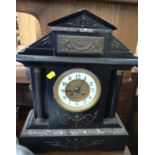A black marble or slate clock. Circa 1890. provenance 80 Rose Street Wokingham.