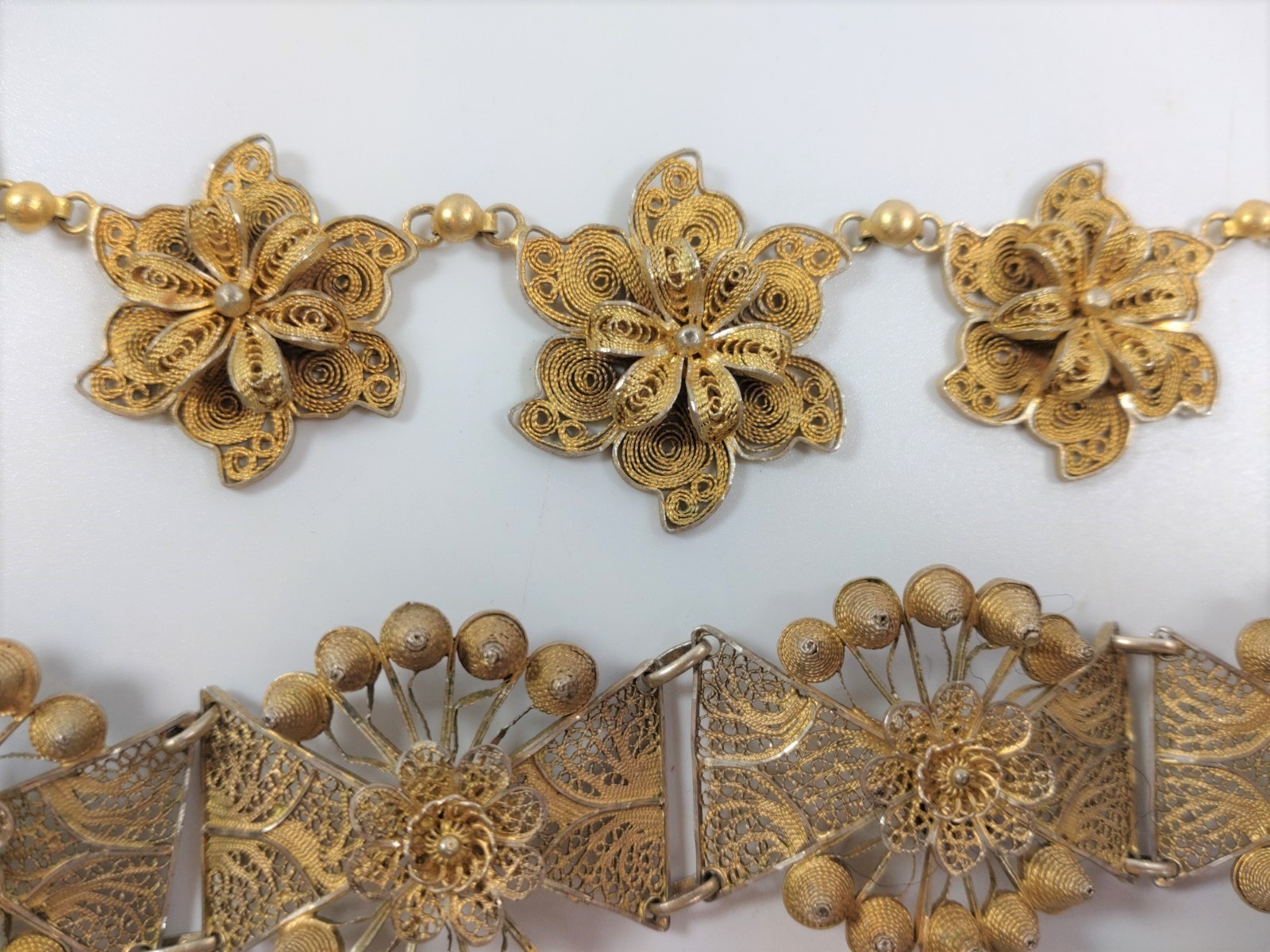 A gold colour metal bracelet and a gold colour metal necklace, each plaque in the form of a flower - Image 2 of 3