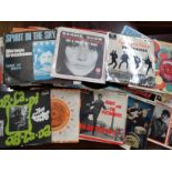 A collection of 7" singles including The Beatles, Sandie Shaw, Bernard Cribbins' "Right Said