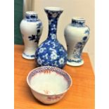 Three small Chinese blue and white vases13cm high and a tea bowl. (4)