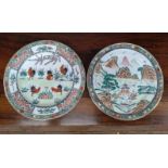 Two Chinese porcelain famille-verte plates, one depicting pavillion within rocky landscape and one