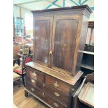 A George III mahogany Cupboard on Chest. Circa 1780. With blind ret decoration. on bracket feet.