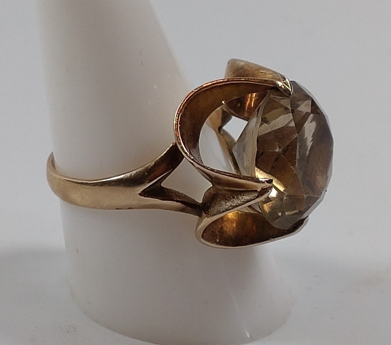 A gold colour metal ring set set with a light colour quartz. Size R. Provenance 80 Rose Street. - Image 2 of 2