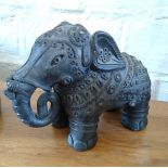An Indian Vintage Pottery Figure of an Elephant. With rich decoration. 16cm high.