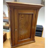 A Victorian Specimen Cabinet. The single panel door opening to reveal a series of drawers.