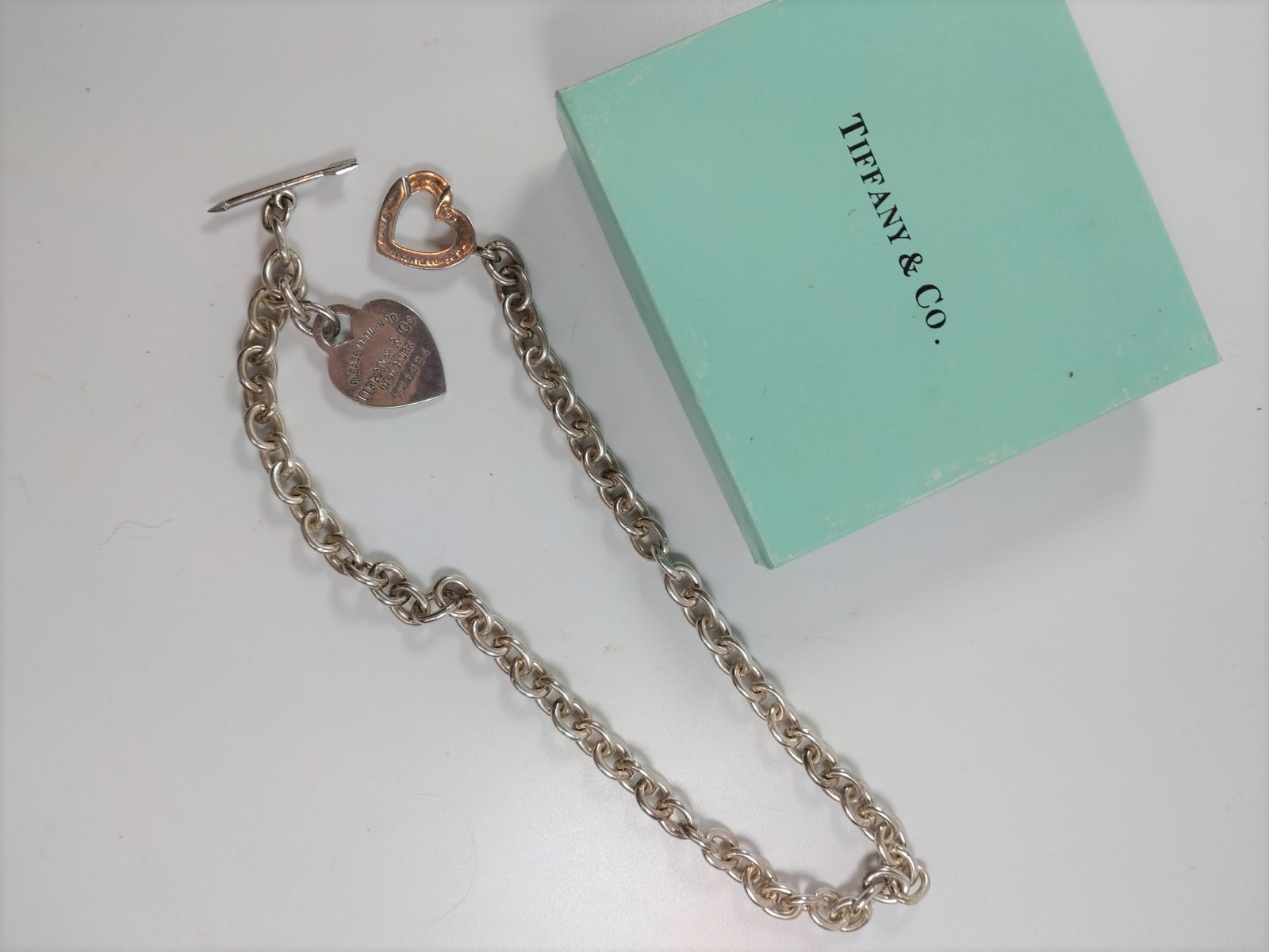 A silver colour metal neck chain by Tiffany of New York (boxed)