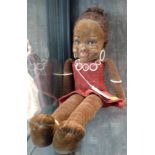 A Nora Wellings black doll, velvet body with glass eyes looking to her left. 1930's 47cm