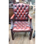 Oxblood leather chair with button and stud feature and padded armrests. provenance 80 Rose Street