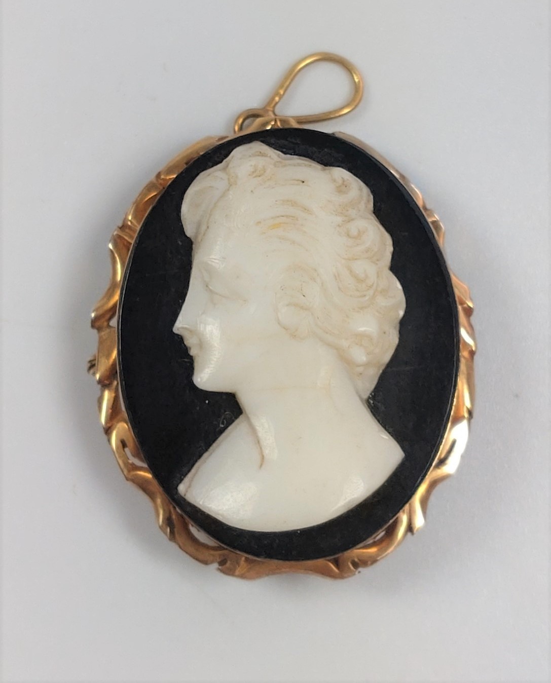 A Sardonyx cameo of a 1930's lady's head & shoulders.