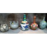 A miscellaneous collection of three bottle vases and two Oriental vases decorated with animals.