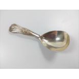 A silver caddy spoon. London 1905