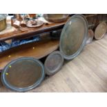 Five Middle-Eastern copper and brass dishes 38cm to 85cm (5)