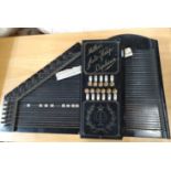 A Muller's Auto-Harp Orpheus in a ebonised frame complete with key and original leather case.