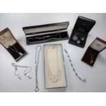 A collection of ten various silver necklaces and bracelets with boxes.