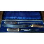 A three-piece carving set, antler handles