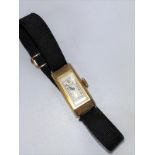 A gold colour metal 1930's lady's wristwatch by Benson London.