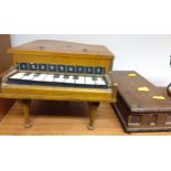A Miniature Grand piano by ISK. With keys. Circa 1930. And the Florentine Musical casket. With a