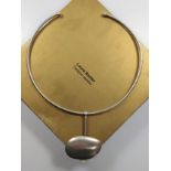 A Laura Baxter designer silver torque necklace with pendant in box together with a Debbie Carlton