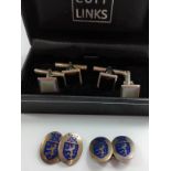 Three silver mounted cuff links, one set Birmingham hallmark with enamel rampant lion