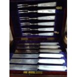 A cased set of six mother of pearl knives and forks