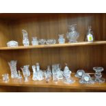 Clear glass items including two clocks, napkin rings, bells, and candlesticks. (27)