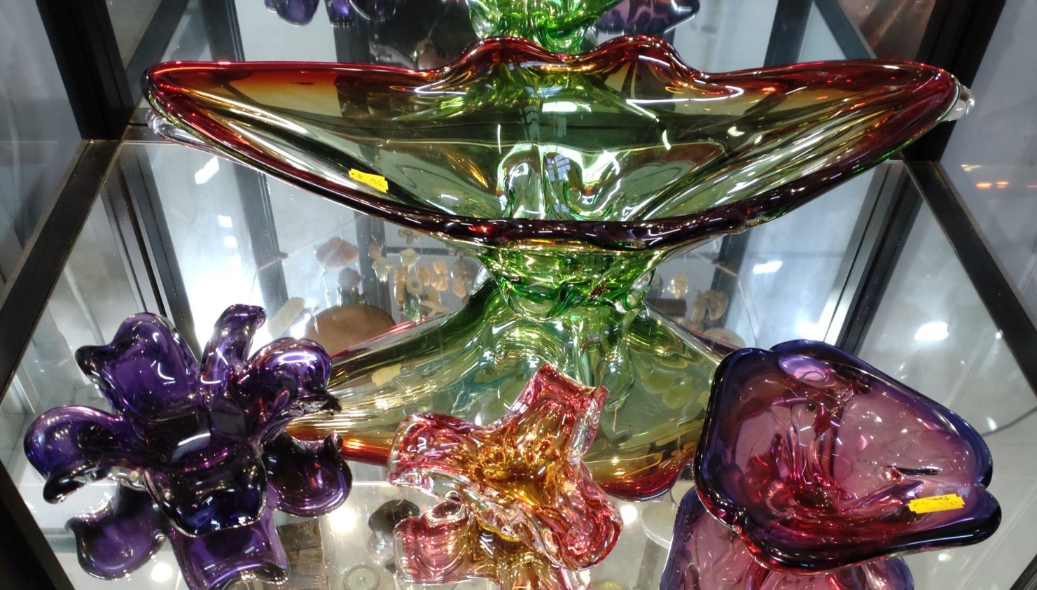 A Murano green and red dish 50cm, a pink and amber bowl, and two other purple bowls (4)