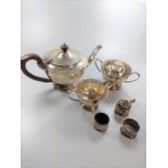 A silver mustard pot, a silver salt, etc. A three-piece silver tea set, consisting of tea pot, cream