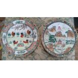 Two Chinese porcelain plates, one depicting Roosters and one depicting a Pavillion within a rocky