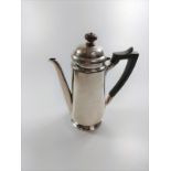A silver coffee pot of plain form. London. By Mappin & Webb.
