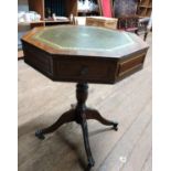 An Octagonal library table. 20th century with inset leather top.