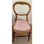 A pink bedroom chair