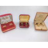 Three boxed pairs of vintage cuff links, one Christian Dior