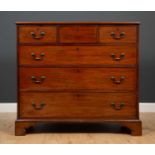 A George III mahogany chest of three short and three long drawers with brass swan neck handles and