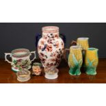 A group of three ceramic jugs possibly by George Jones formed as corn on the cobb, the largest