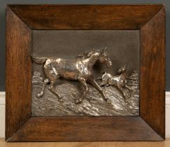 A continental white metal relief with a horse and a foal, initialled BG, 27cm x 23cm, mounted in a