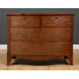 A George III mahogany bow front chest of two short and two long drawers with brass handles and