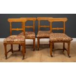 A set of four Victorian oak dining chairs in the manner of George Edmund Street, each 47cm wide x