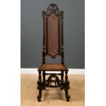 An antique oak side chair 19th century and later, the tall back with carved and pierced cresting,