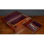 A Victorian mahogany writing slope, the lift top over fitted interior and velvet writing surface,