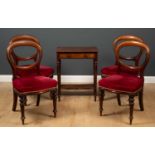 A 19th century mahogany side table with single drawers and concave undertier, on carved turned