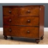 An early Victorian mahogany bow front chest of two short and two long drawers with turned knob