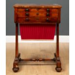 A Victorian mahogany work table, with lift top over fitted interior and three drawers (two false and