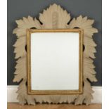 A late 20th century painted wooden mirror of foliate design, 47.5cm wide x 70cm highCondition