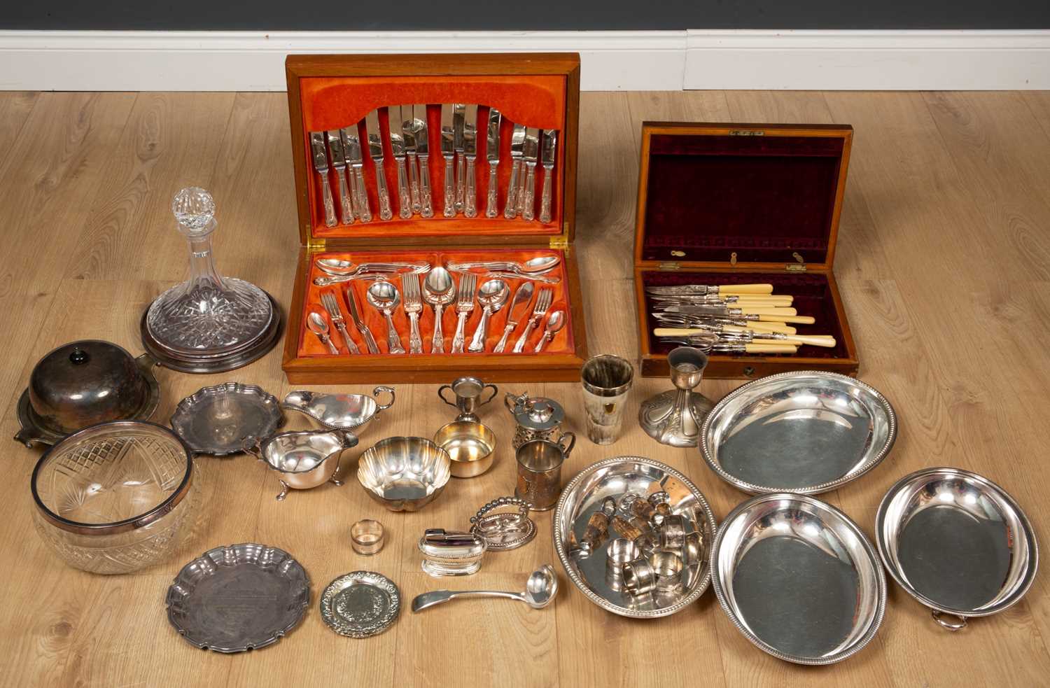 A group of silver and silver plates wares to include a silver rimmed cut glass bowl, a silver rimmed