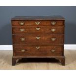 An early 18th century walnut chest with parquetry decoration and four long graduated drawers with