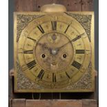 An 18th century fruitwood longcase clock the brass dial with arabic and roman numerals signed