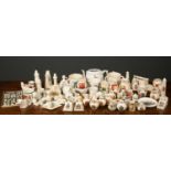 A collection of W.H. Goss crested china, to include jugs, toby jugs, ewers and cups, a collection of