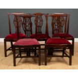 A set of five Georgian mahogany dining chairs to include a carver and two further matching chairs,