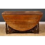 An oak drop leaf gateleg table 147cm wide x 63cm deep (flaps down) x 76cm highCondition report: Some