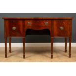 A Georgian style mahogany bow front sideboard the central drawer flanked by cupboards, 153cm wide